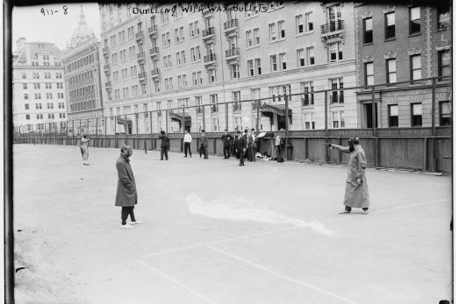 A wax bullet duel outside of Carnegie Hall, 1909